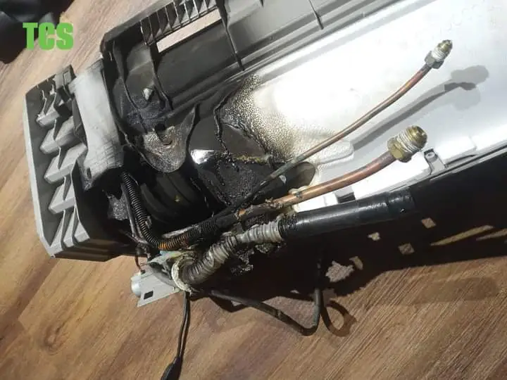 Technician testing repaired fridge cooling performance